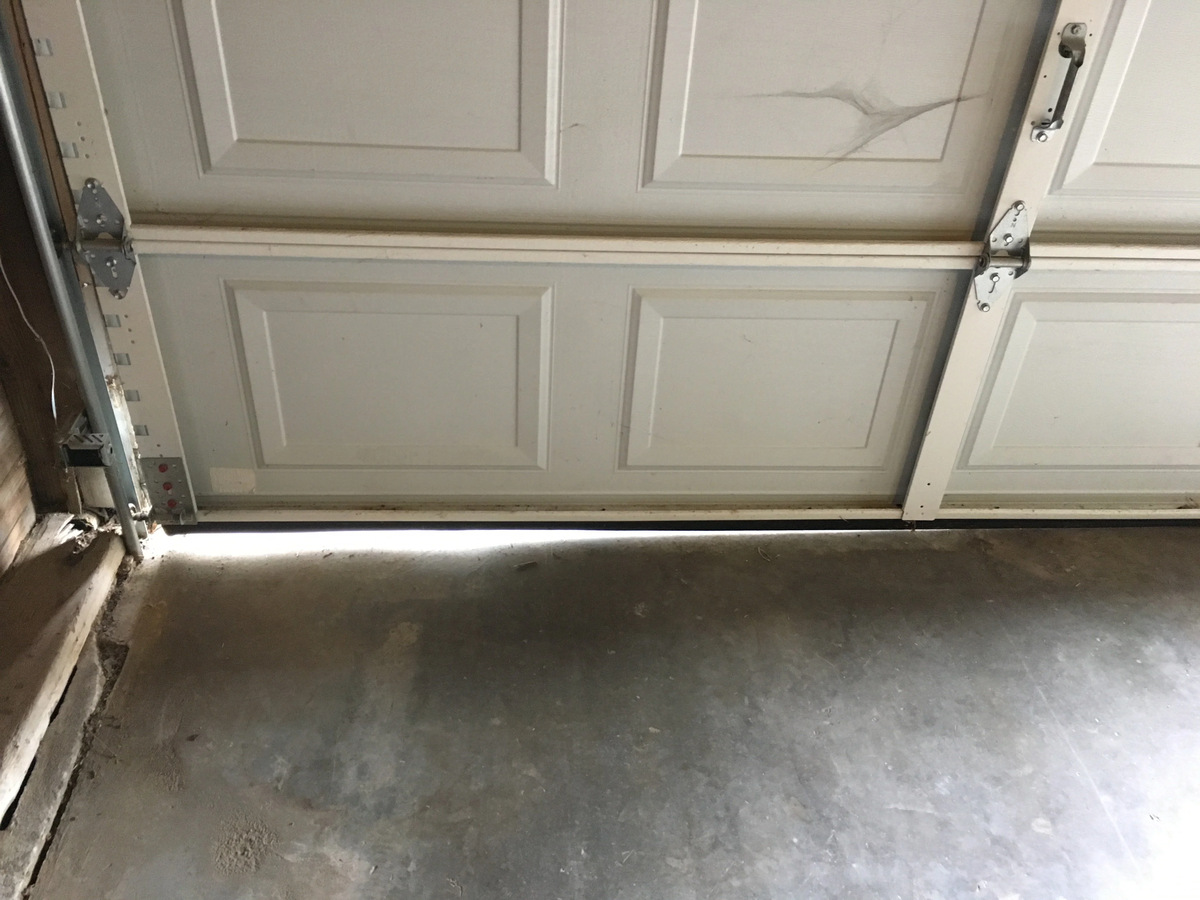 how to seal garage door gaps